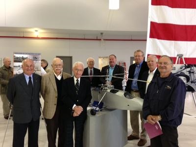 Sikorsky Aircraft retirees gather around a 1/4 scale model of the VS-300 Sikorsky Aircraft retirees gather around a 1/4 scale model of the VS-300